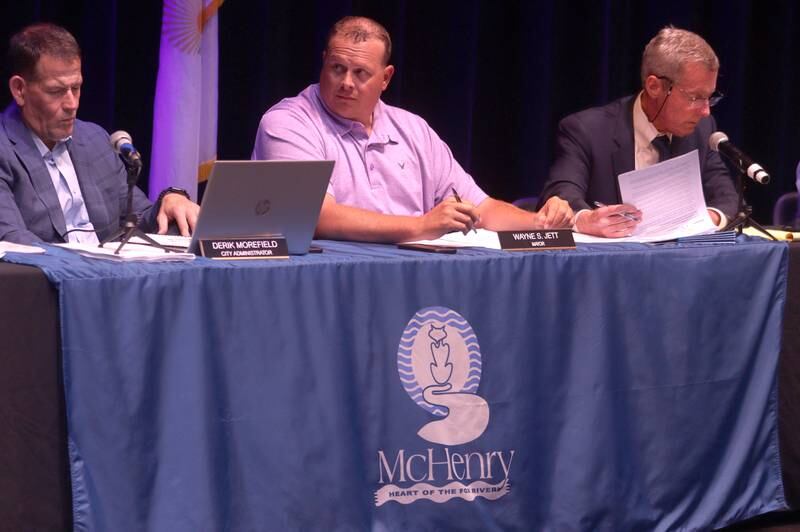 Mayor Wayne Jett, center, and the McHenry City Council on Monday, Aug. 7, 2023, addressed a Jack Pease proposal to mine 110 acres at Route 120 and Chapel Hill Road. The meeting was held in McHenry High School’s Upper Campus auditorium.