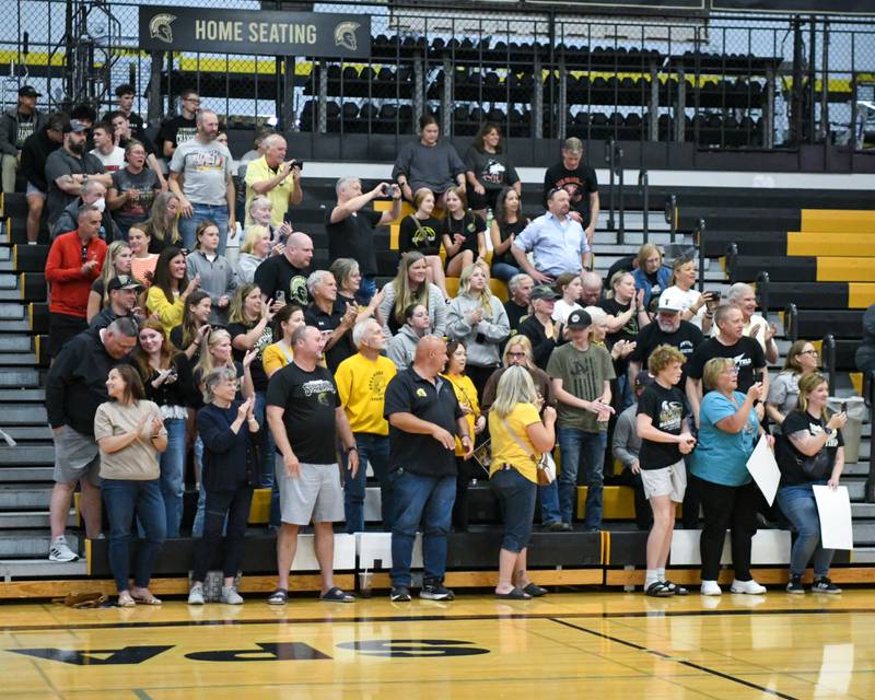 Sycamore community members applaud and give a standing ovation as the Sycamore boys track team enter the gym for the pep rally on Tuesday June 4, 2025, as they brought back the 2A track meet championship trophy.