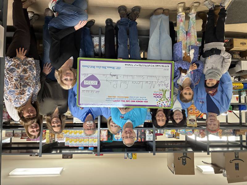 Members of 100+ Women Who Care of Will County had their “big check” presentation donating $10,725 to the New Lenox Family Services Food Pantry on Dec. 22, 2025.