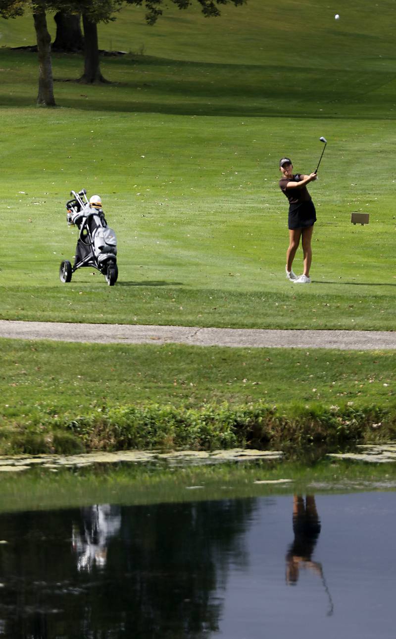 Jacobs’ Marley Skarosi watches her approach shot on the 12th hole during the Fox Valley Conference Girls Golf Tournament Wednesday, Sept. 24, 2025, at Crystal Woods Golf Club in Woodstock.