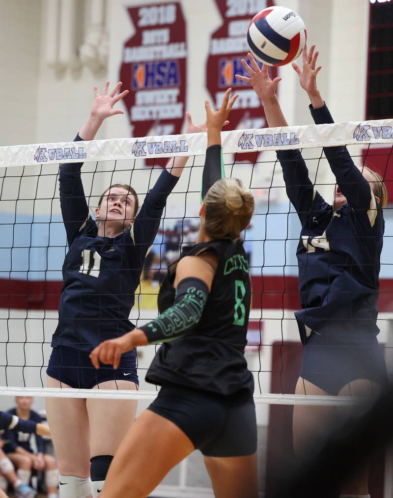Lemont's Colleen Arundel, left, and Kaitlyn Wilson reach to bkock a tip by Providence's Demi Carbone during Providence's victory in two sets, 25-25, 25-18, over Lemont in the IHSA Class 3A Kankakee Sectional championship on Thursday, Nov. 6, 2025.