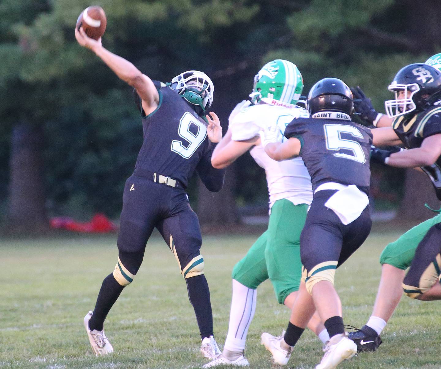 St. Bede quarterback Max Bray throws a long pass down the field against Ridgewood on Friday, Sept. 15, 2023 at St. Bede Academy.