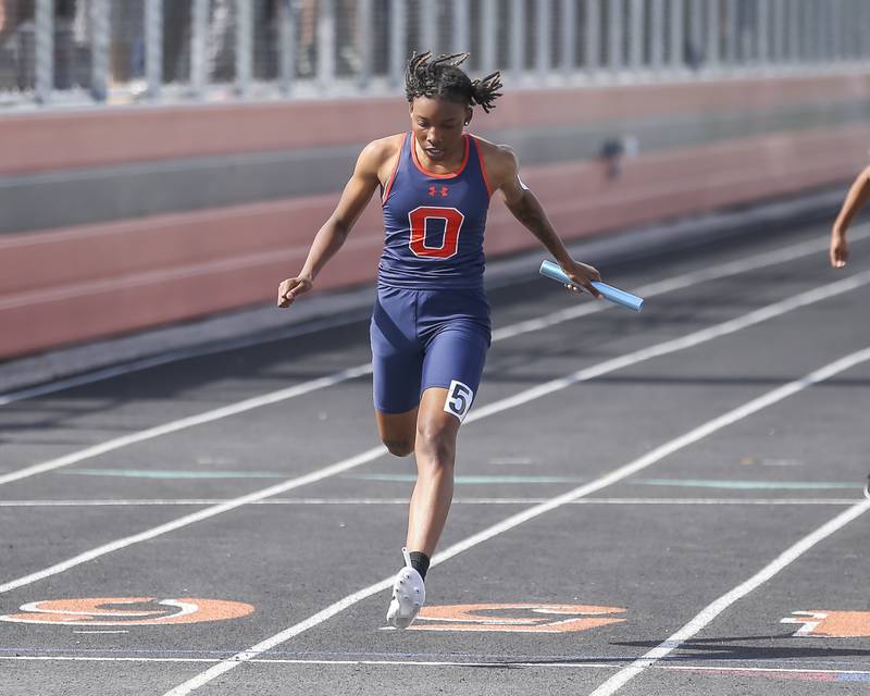 Oswego's Lindsey Arand runs in the 4x800m during Southwest Prairie Conference Girls Track and Field Meet Wednesday, May 7, 2025 in Minooka.