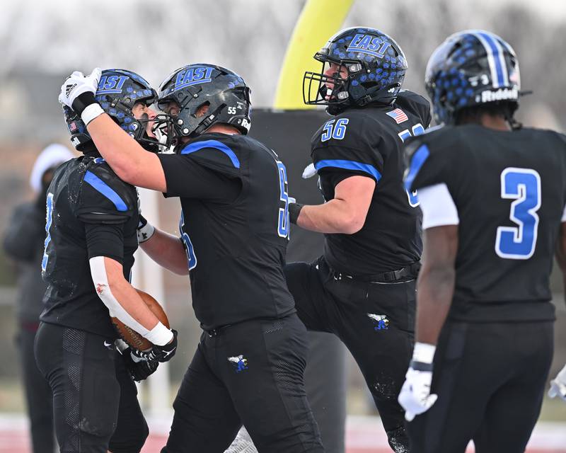 Lincoln-Way East's James Kwiecinski (2) celebrates with teammates after scoring a touchdown during the IHSA Class 8A Semifinals on Saturday, November. 19, 2022, at Frankfort.
