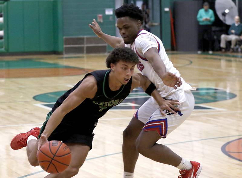 Crystal Lake South's AJ Demirov drives to the basket against Dundee-Crown’s Terrion Spencer during the boy’s game of McHenry County Area All-Star Basketball Extravaganza on Sunday, April 13, 2025, at Alden-Hebron’s Tigard Gymnasium in Hebron.