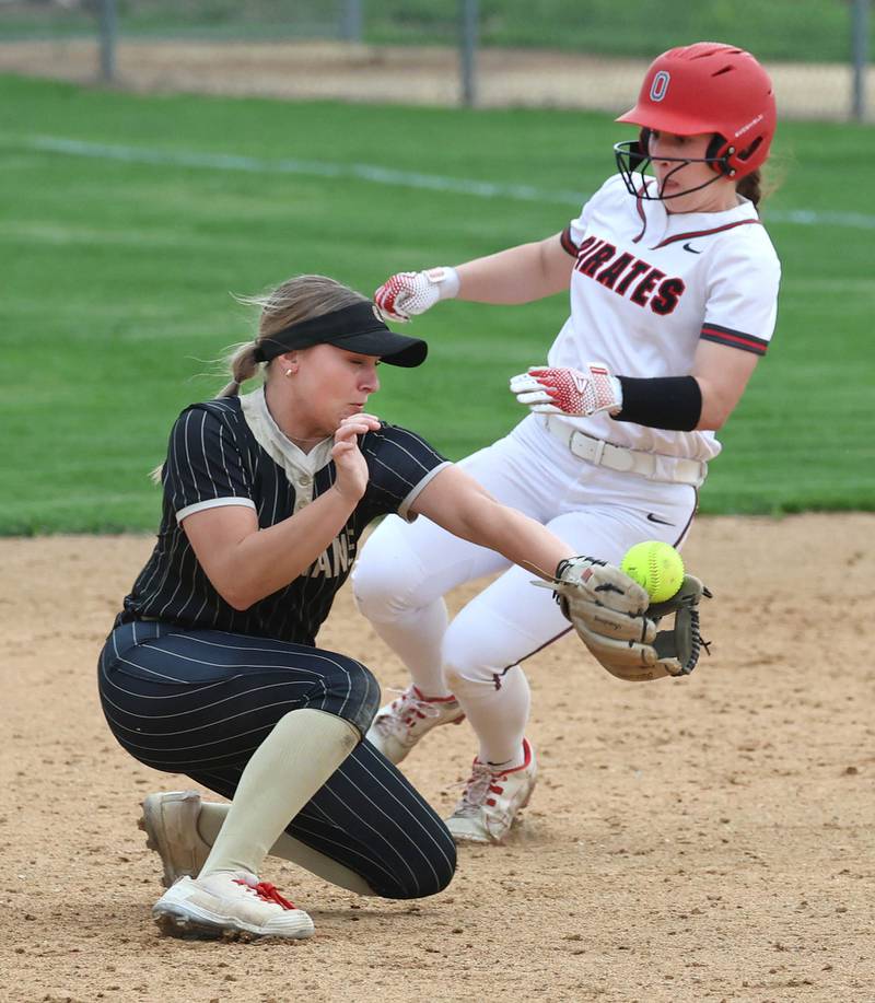 Ottawa's Avery Leigh steals second base as Sycamore's Addison Armstrong takes the throw Friday, April 17, 2026, during thier game at Sycamore High School.
