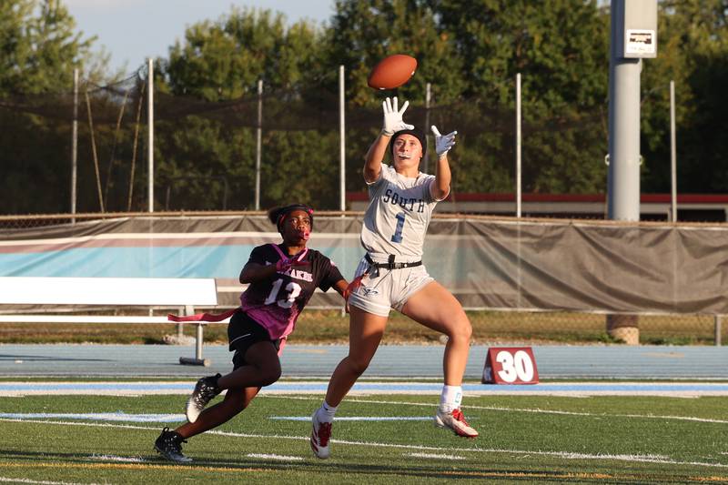 Plainfield South's Carly McDonald catches a first down pass ahead of Kankakee's Jasyia Wesby during the Kays' 40-26 victory over Plainfield South on Monday, Oct. 6, 2025.
