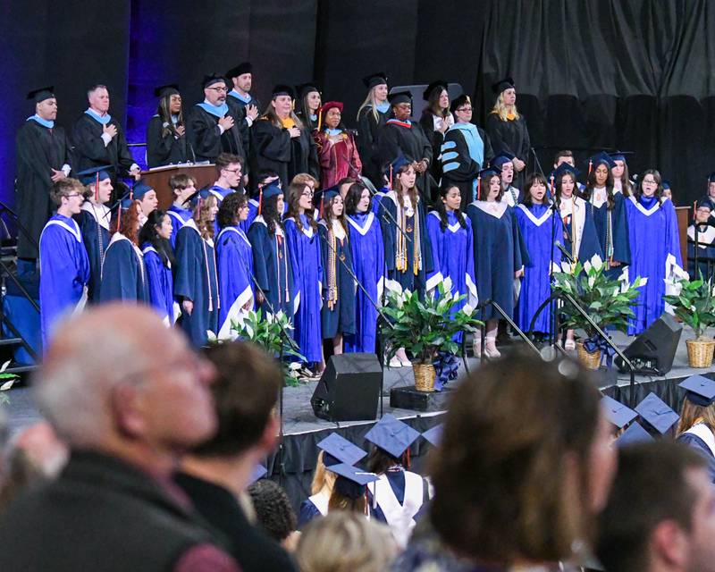 Oswego High School A Capella Choir signs the Star-Spangled Banner during the graduation ceremony on Saturday May 17, 2025, held at the Convocation Center in DeKalb.