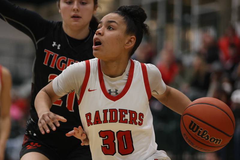 Bolingbrook’s Angelina Smith drives to the basket against Edwardsville in the Class 4A Illinois Wesleyan Super-sectional. Friday, Feb. 25, 2022, in Bloomington.