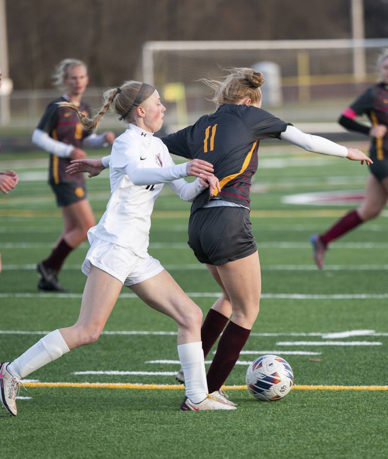 Prairie Ridge's Carrie Sosnowski, left, battles for the ball with Richmond-Burton's Margaret Slove during their game on Wednesday, April 5, 2023 at Richmond-Burton High School in Richmond. Ryan Rayburn for Shaw Local