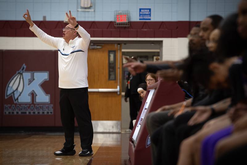 Kankakee's head girls coach Kurt Weigt calls out to his players on the floor in a game against Thornton on Thursday, December 4, 2025.