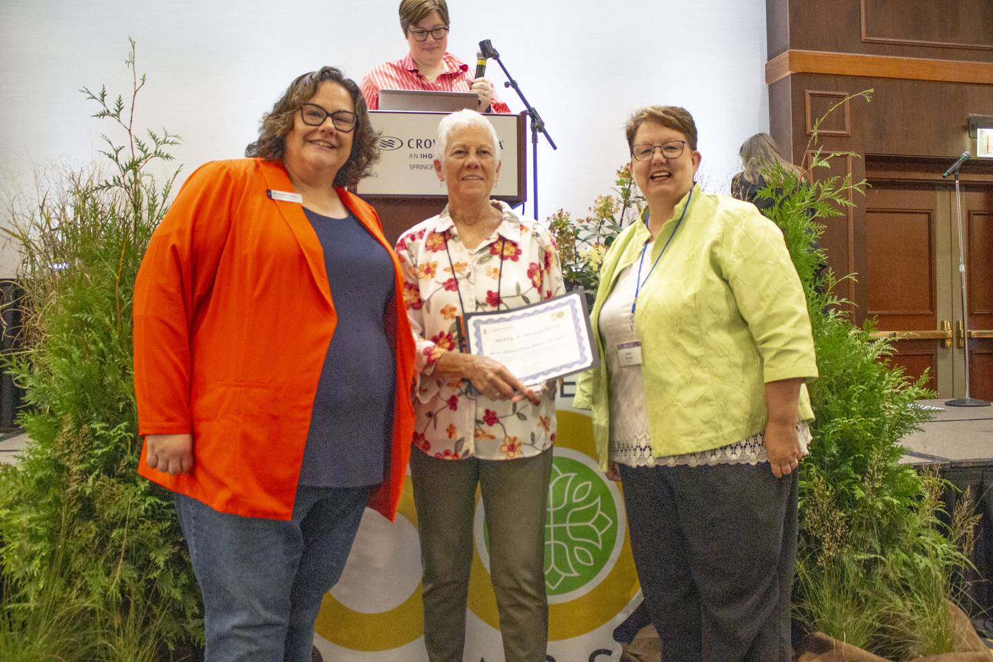 Merry Jo Montgomery of Wilmington (center) received the 2025 Outstanding Master Gardener Award from Amanda Taylor (left), director of Workforce Development, and Janice McCoy, associate director of the University of Illinois Extension, at the 50th anniversary Master Gardener Conference  in Springfield on Sept. 4-5, 2025.