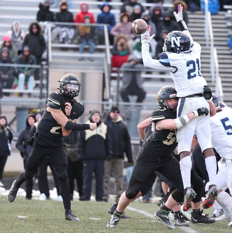 Nazareth's Lesroy Tittle tries to knock down a pass from Sycamore's Elijah Meier Saturday, Nov. 18, 2022, during their state semifinal game at Sycamore High School.