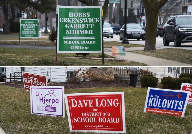 Dueling displays of campaign signs for Wheaton-Warrenville Unit District 200 school board candidates are posted along North Main Street in Wheaton. (Paul Valade | Staff Photographer)