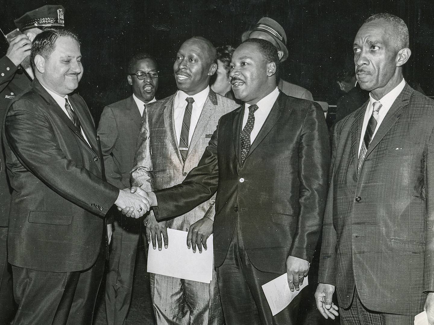 Joliet Mayor Maurice Berlinsky (left) welcomes civil rights leader Martin Luther King Jr. to a rally June 4, 1965, at Joliet Memorial Stadium. The Rev. V.M. Herron, pastor of the Second Baptist Church, is next to King and the Rev. A.M. Varnado of Mt. Olive Baptist Church on the right.