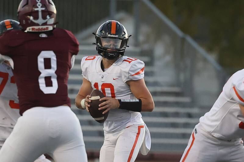 Lincoln-Way West’s Chase Hetfleisch looks to pass against Lockport on Friday, Oct. 18, 2024 in Lockport.