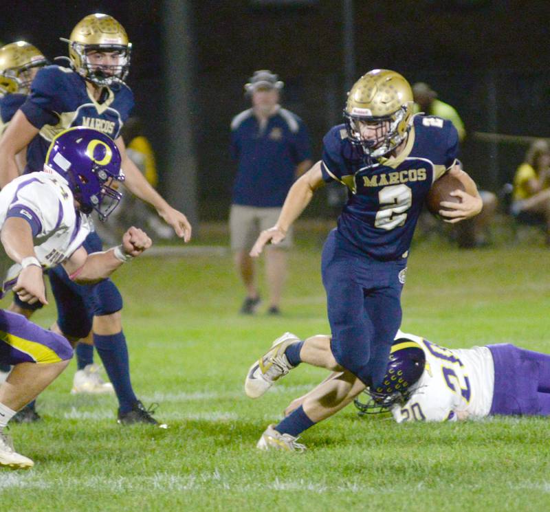 Polo's JT Stephenson makes a move away from an Orangeville defender during 8-man action at Polo High School on Friday, Oct. 3, 2025.