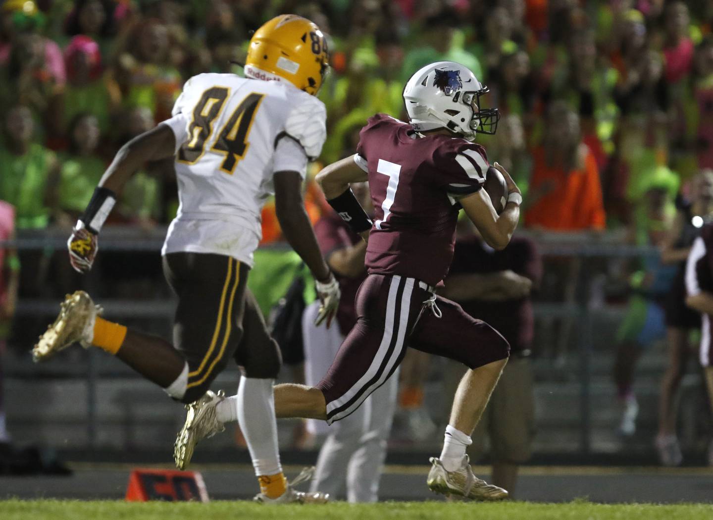 Prairie Ridge's Tyler Vasey, right, pulls away from Jacobs' T.O. Boddie as Vasey returns a kickoff for a touchdown during a Fox Valley Conference football game between Jacobs and Prairie Ridge Friday, Sept. 16, 2022, at Jacobs High School in Algonquin.