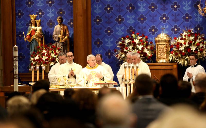 The Most Reverend David Malloy (center), Bishop of Rockford, speaks at St. Peter Catholic Church in Geneva during the Mass of Christian Burial for Reverend Jonathan Bakkelund on Wednesday, Jan. 31, 2024.