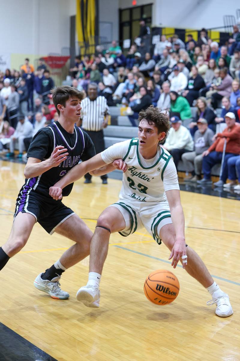 Bishop McNamara's Karter Krutsinger drives to the lane during the Fightin' Irish's 66-52 victory over El Paso-Gridley in the IHSA Class 2A Herscher Regional championship on Friday, Feb. 27, 2026.