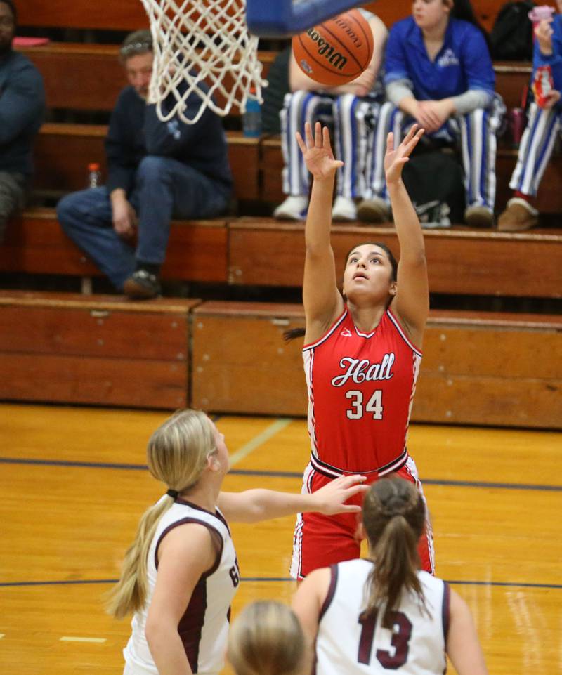 Hall's Natalia Zamora shoots a jump shot in the lane over Illinois Valley Central's Kayt Miller and teammate Caitlyn Gillette during the Princeton Holiday Girls Basketball Tournament on Tuesday, Nov. 19, 2024 at Princeton High School.