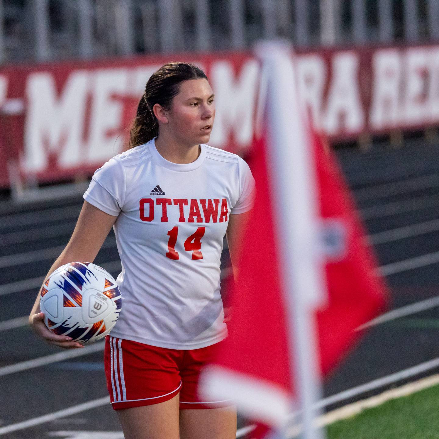 Kalie Anderson (14) of Ottawa contemplates inbound throw on Tuesday, May 21, 2025 at Malone Field in Metamora.