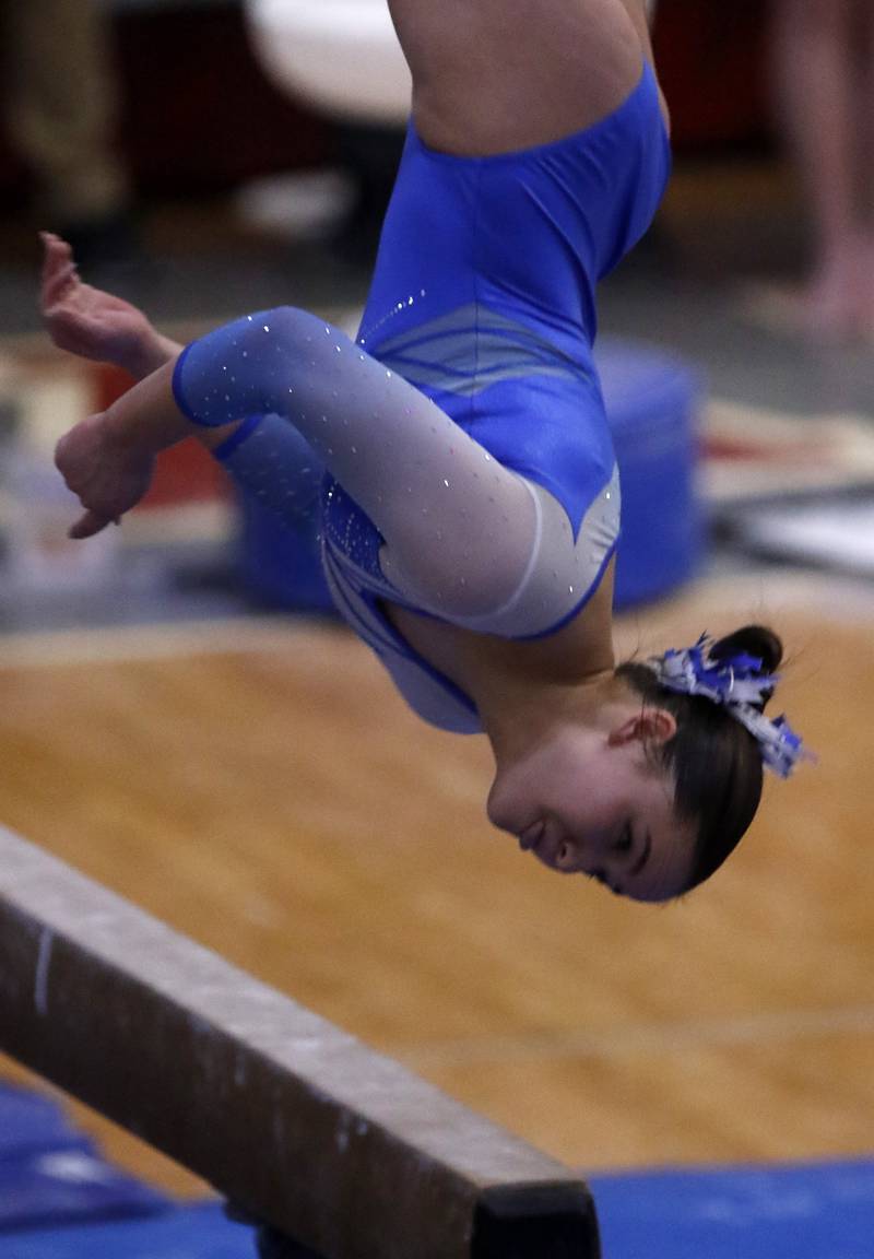 Vernon Hills’ Livy Tan competes in the preliminary round of the balance beam on Friday, Feb. 21, 2025, during the IHSA Girls State Final Gymnastics Meet at Palatine High School.