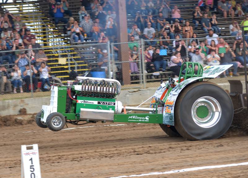 Austin Dornbush of Albany drives his 2021 modified tractor "Time Maker" in the tractor pull at the Ogle County Fair on Thursday, July 31, 2025.