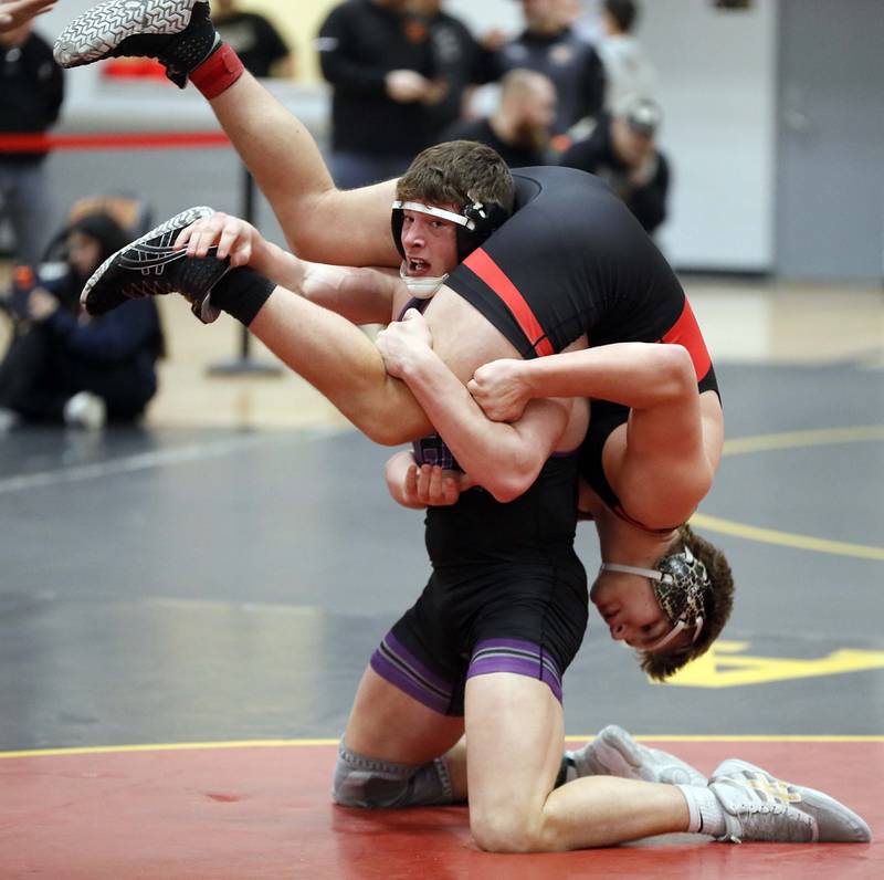 Cael Brezina of Downers Grove North wrestles Asher Sheldon of Batavia at 220 pounds during the Batavia wrestling invite Saturday January 14, 2023 in Batavia.