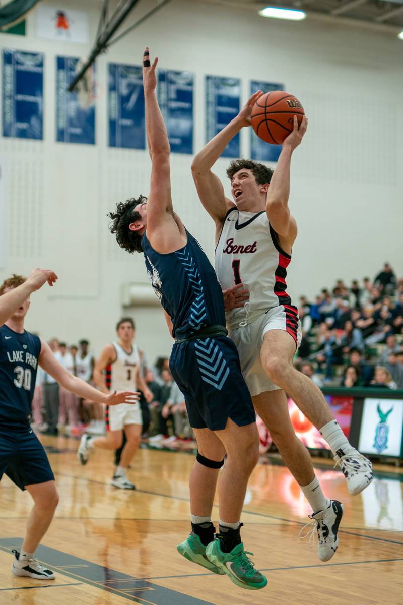 Benet’s Sam Driscoll (1) shoots the ball in the post against Lake Park's Dennasio LaGioia (24) during a Bartlett 4A Sectional semifinal boys basketball game at Bartlett High School on Tuesday, Feb 28, 2023.