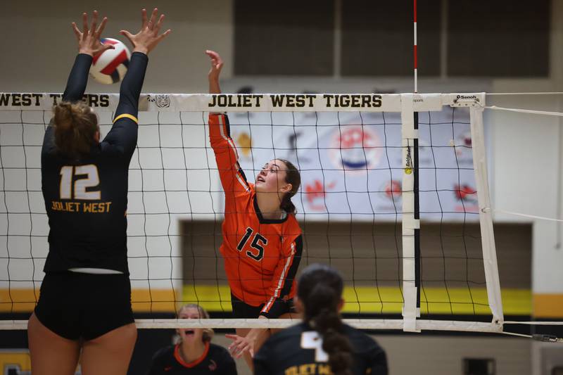 Lincoln-Way West’s Ellyana Decker hits a shot against Joliet West on Tuesday, Sept. 12, in Joliet.