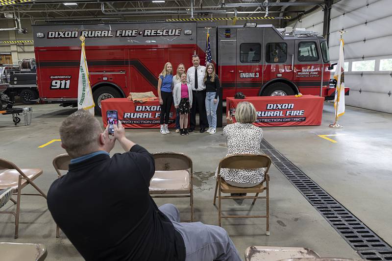Derrick Storey with family members Natalie (left), 13, wife Jennifer, Avery, 10, and Madison, 15, stands for photos after the ceremony Tuesday, May 14, 2024, at Dixon Rural.
