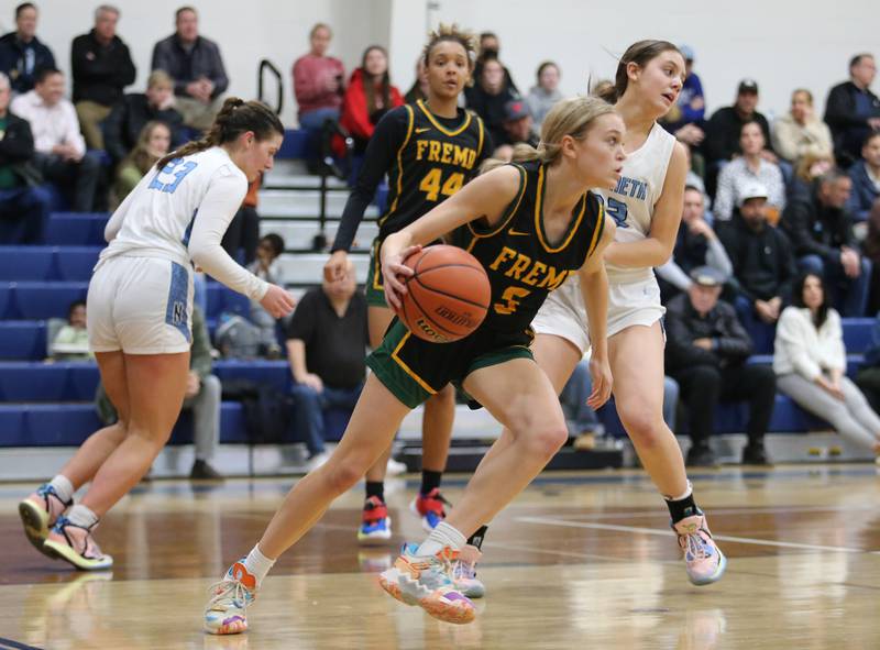 Fremd's Ellie Thompson (5) brings the ball up court during the girls varsity basketball game between Fremd and Nazareth on Monday, Jan. 9, 2023 in La Grange Park, IL.