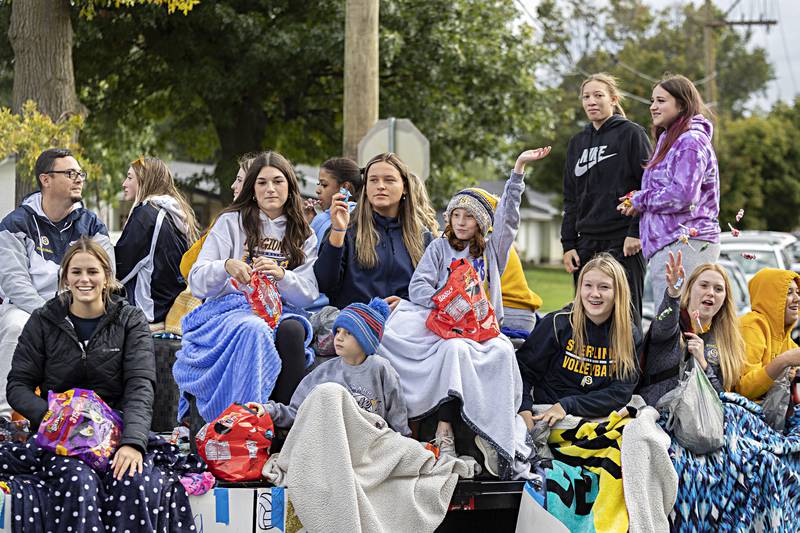 The Sterling volleyball team fires off candy from their float Friday, Oct.6, 2023 during the parade.