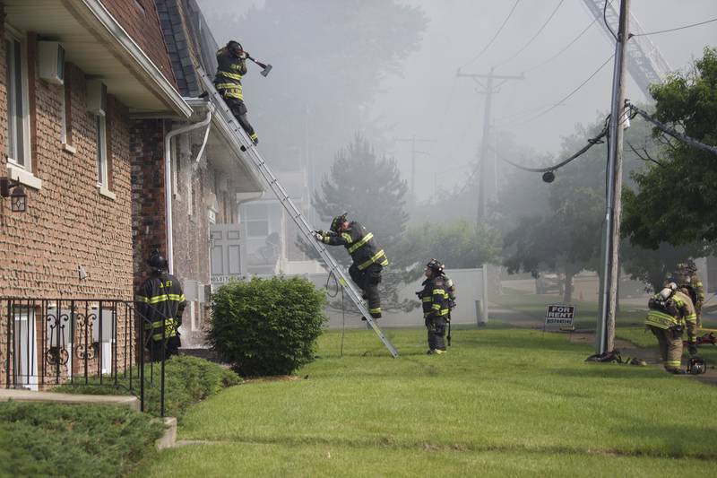 Joliet firefighters at the scene of an apartment fire on Tuesday, June 10, 2025, near Essington Road in Joliet.