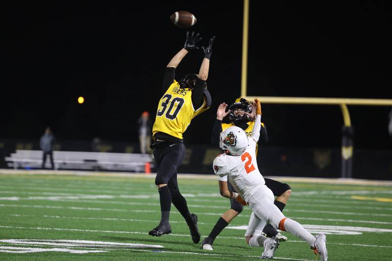 Joliet West’s Austin Kittl makes a leaping interception against Plainfield East on Friday, Oct. 13, 2023 in Joliet.