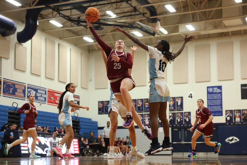 Plainfield North’s Sydney Scott lays in a shot against Plainfield South on Thursday, Jan 9, 2025.