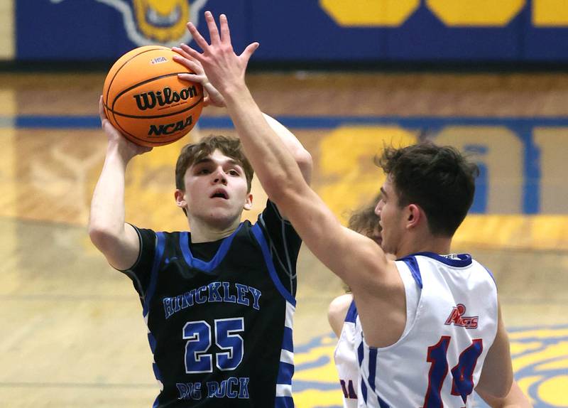 Hinckley-Big Rock’s Alex Casanas shoots over Ida Crown’s Ezra Comrov during their Class 1A sectional game Wednesday, March 5, 2025, at Somonauk High School.