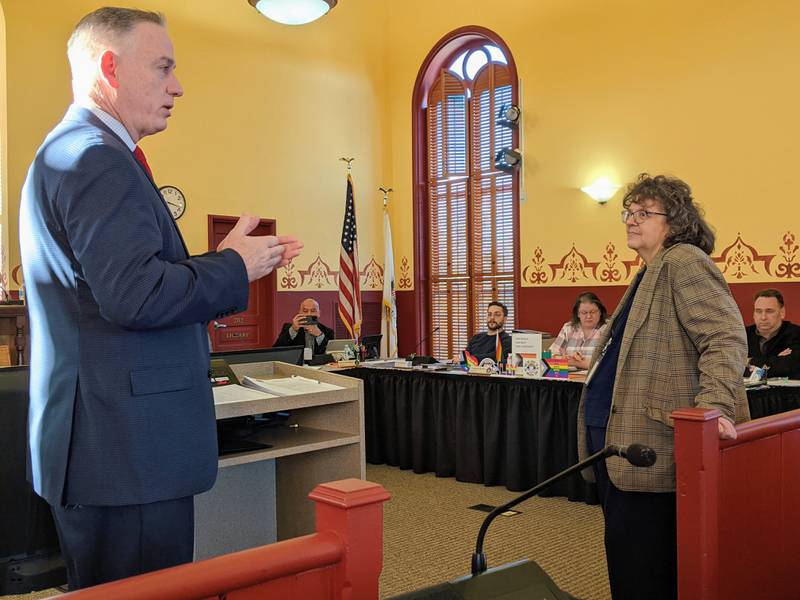 Kendall County Judge John McAdams, left, spoke about the work of Kendall County First Assistant State's Attorney Brenda Karales, right, during the Jan. 20 Kendall County Board meeting.