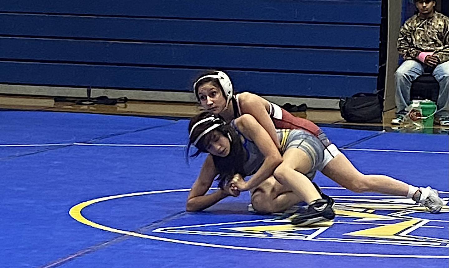 Lockport's Averi Colella (top) tries to prevent Joliet Central's Valerie Ruiz-Flores from escaping in a recent match.