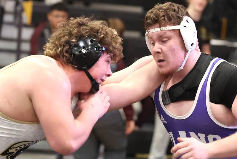 Sycamore’s Lincoln Colley and Plano’s Alex Diaz lock up during their 285 pound championship match Saturday Jan. 21, 2023, during the Interstate 8 Conference wrestling tournament at Sycamore High School.