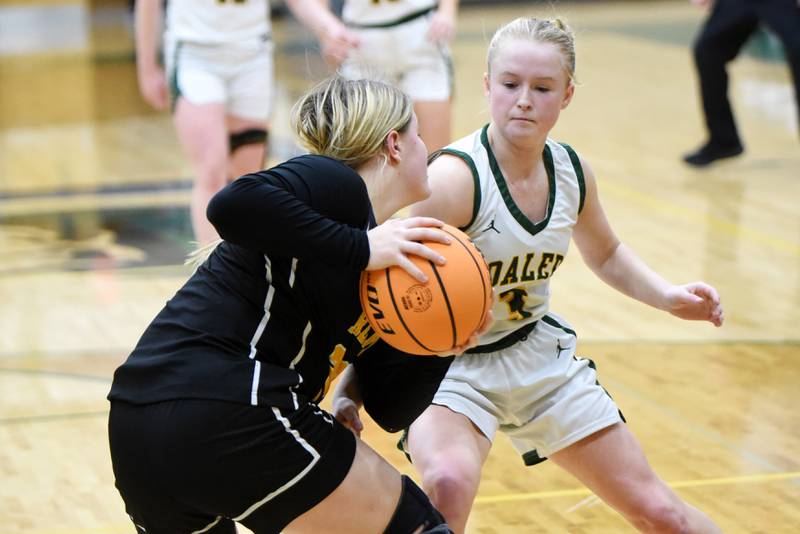 Coal City's Sydney Larson, right, tries to steal the ball from Reed-Custer's Harlie Liebermann during an IHSA Class 2A Coal City Regional semifinal Tuesday, Feb. 18, 2025.