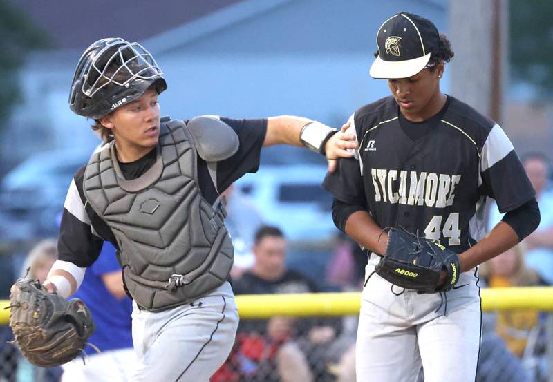 Sycamore catcher Kyle Hartmann visits the mound to talk to pitcher Tyler Townsend during their Class 3A sectional final game against Burlington Central Friday, May 31, 2024, at the Sycamore Community Sports Complex.