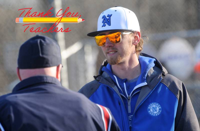 Newark head baseball coach Josh Cooper talks with the umpire during a varsity baseball game against Morris at Newark High School on Wednesday, Mar. 29, 2023.