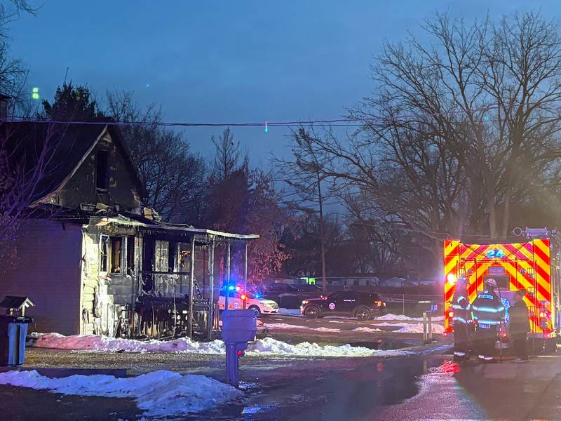 A home stands badly damaged from a fire on Dec. 19, 2025, in the Lotus Woods neighborhood near Spring Grove.