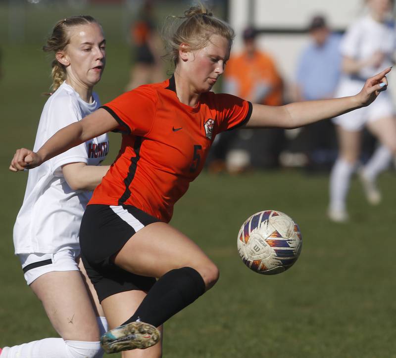 Crystal Lake Central's Lizzie Gray heads towards the goal in front of Huntley's Elizabeth Johnson during a Fox Valley Conference soccer game on Tuesday, April 9, 2024, at Crystal Lake Central High School.