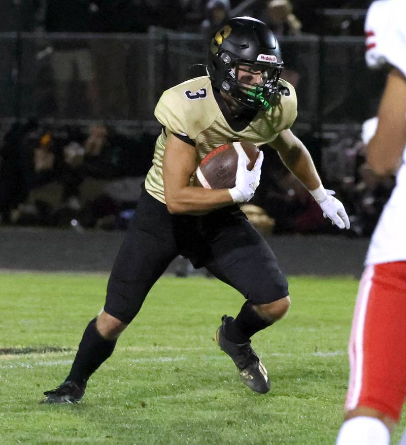 Sycamore's Carter York intercepts an Ottawa pass and returns it for a touchdown during their game Friday, Sept. 27, 2024, at Sycamore High School.