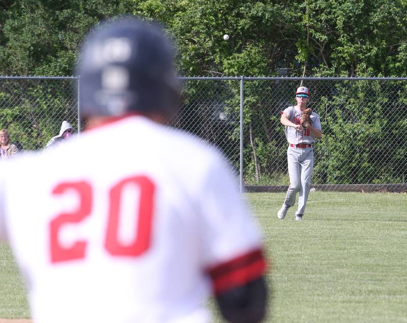 Ottawa's Jack Henson fields a ground ball after Streator's Brady Grabowski rounds first base on Tuesday, May 16, 2023 at Streator High School.