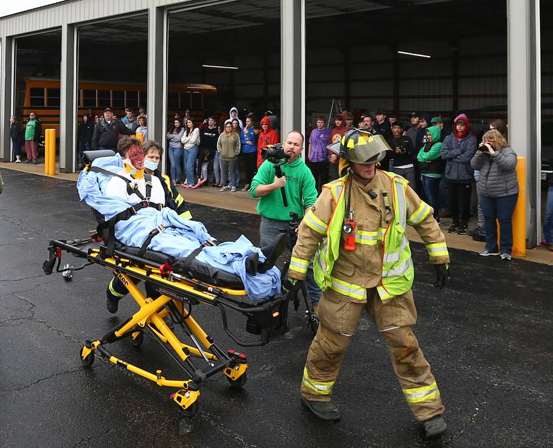 Tom Clifford, a student at Leland High School, is taken by ambulance during a Mock Prom drill at Leland High School on Friday, May 6, 2022 in Leland.