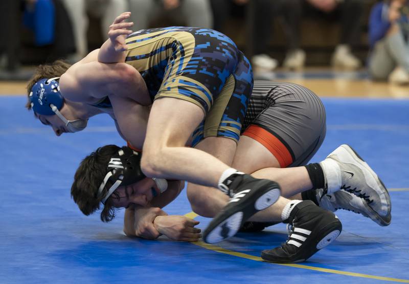 Crystal Lake Central's Daniel Snow, bottom, takes on Wheeling's Max Katz in the 132 pound boutduring the Class 2A Dual Team wrestling Sectional on Tuesday, February 25, 2025 at Wheeling High School. Ryan Rayburn for Shaw Local